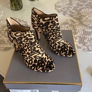 Leopard print opened toe 3.5” heels.